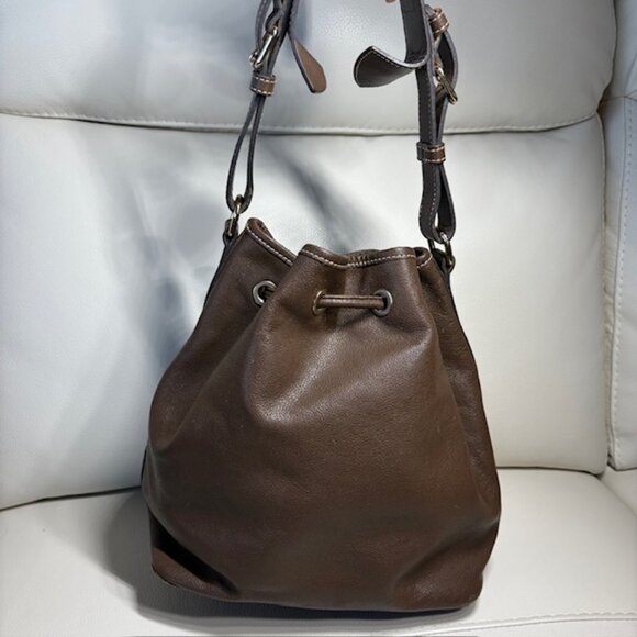 Dooney & Bourke Drawstring Bucket Bag Pebbled Leather Brown Grommets Tassels - Picture 2 of 13